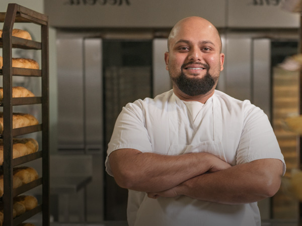 Baker with arms crossed