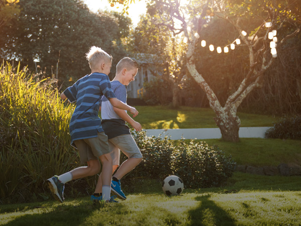 Two boys playing football