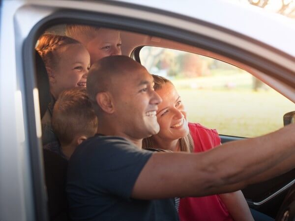 Family taking a selfie in a car